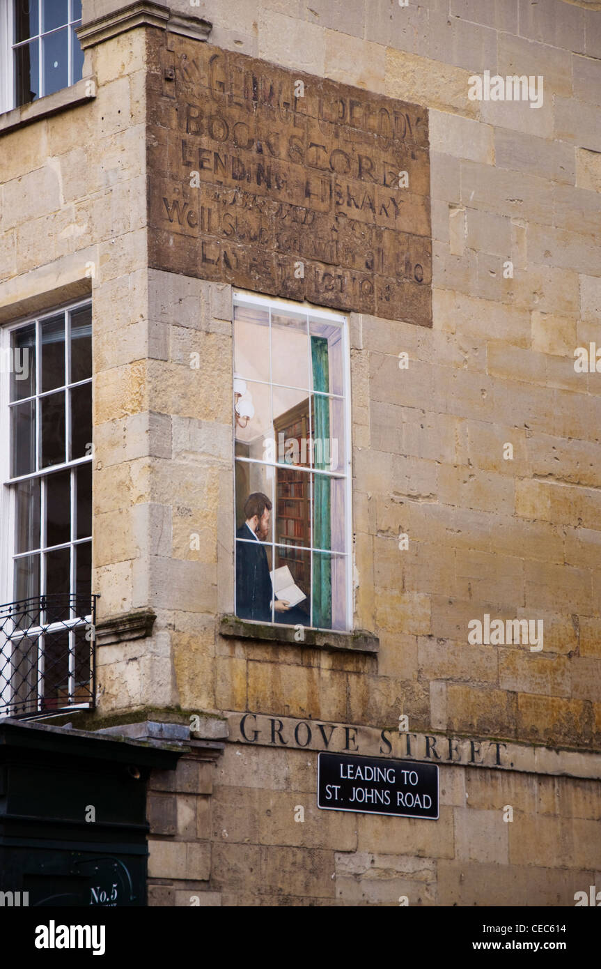 Painted window art and old book shop signage Stock Photo