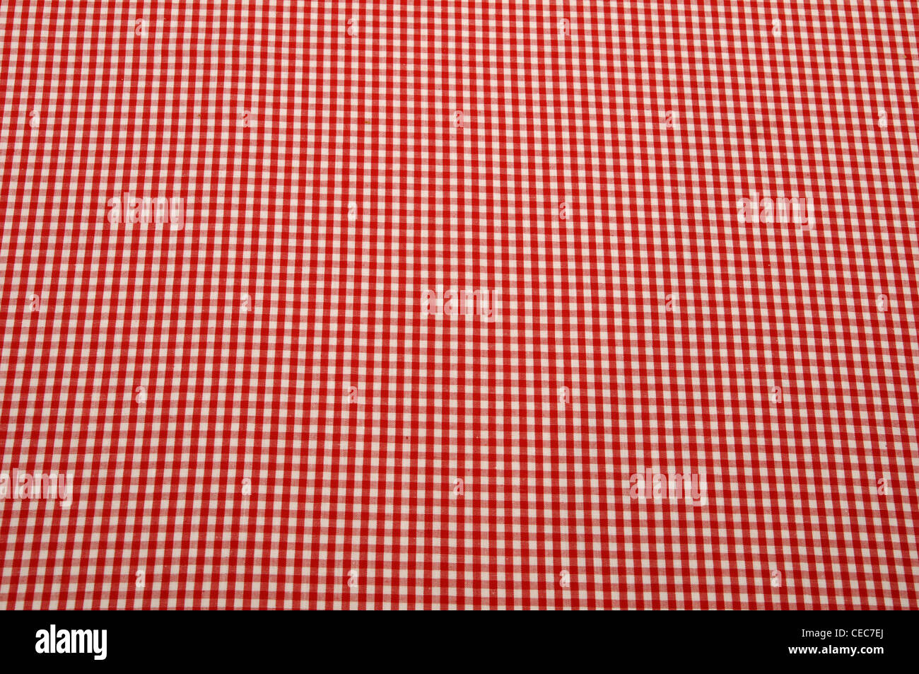 A red and white table cloth spread out and laying flat Stock Photo