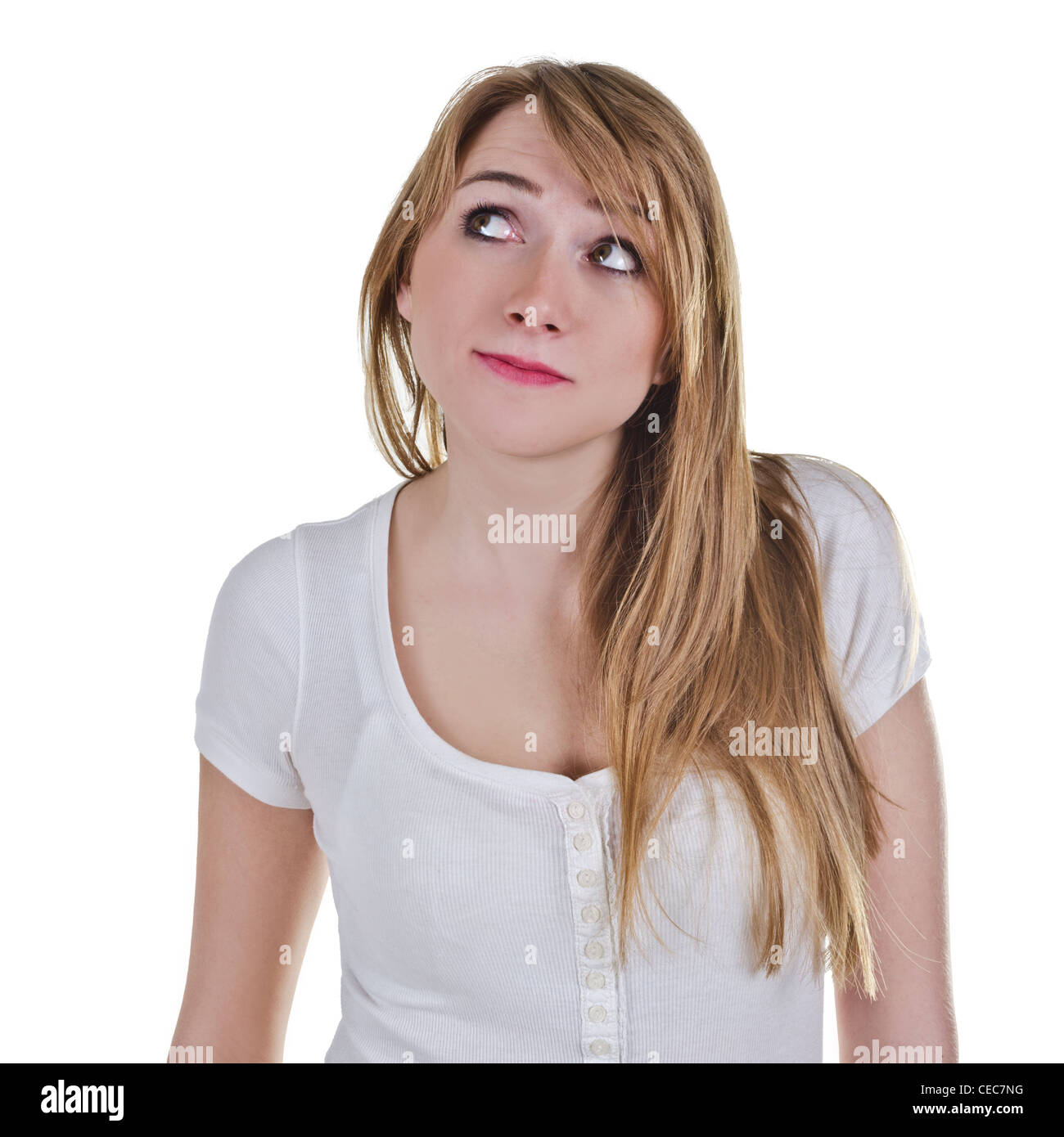 Young woman looking up-right with expression as she is satisfied  about something Stock Photo
