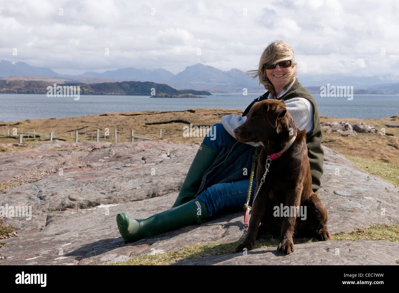 Portrait of a woman and her dog, Cove, Loch Ewe, Wester Ross, Scotland, UK Stock Photo