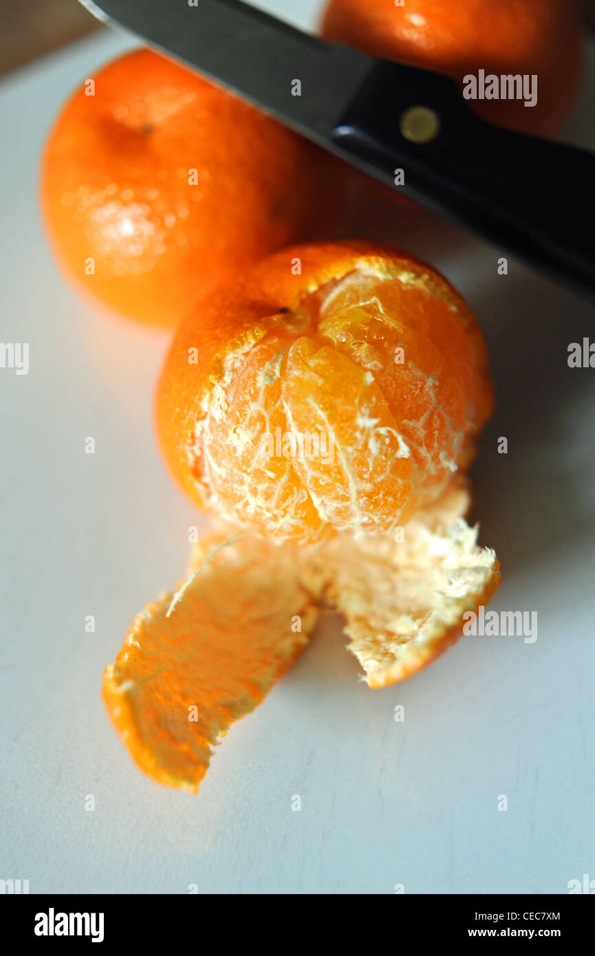 Peeled skin off a satsuma fruit rich in vitamin C for good health Stock Photo