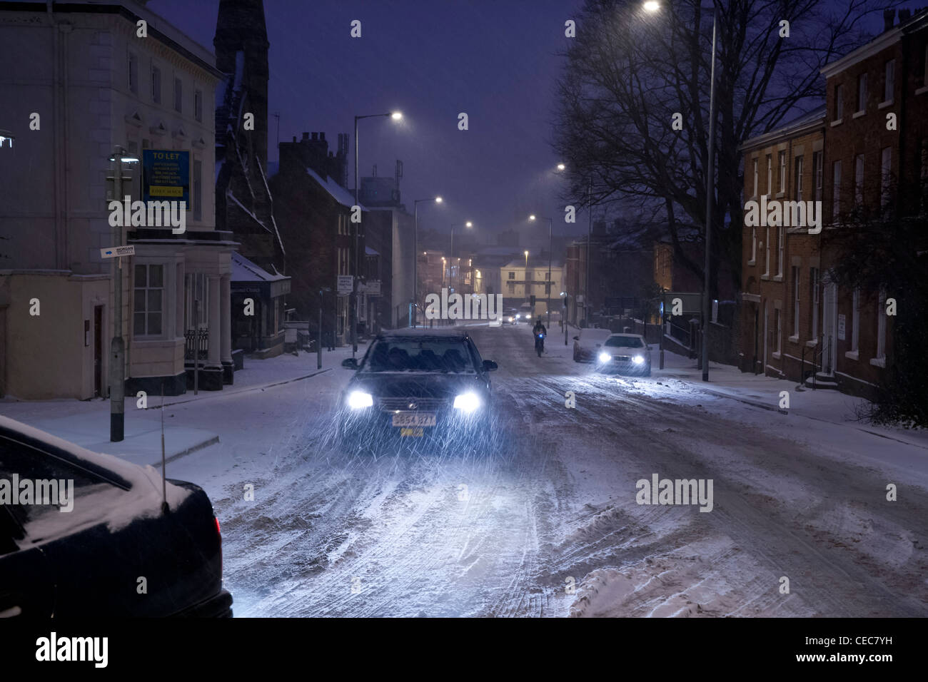 Cars in evening rush hour traffic in snow,snowy,wintry weather Stock Photo