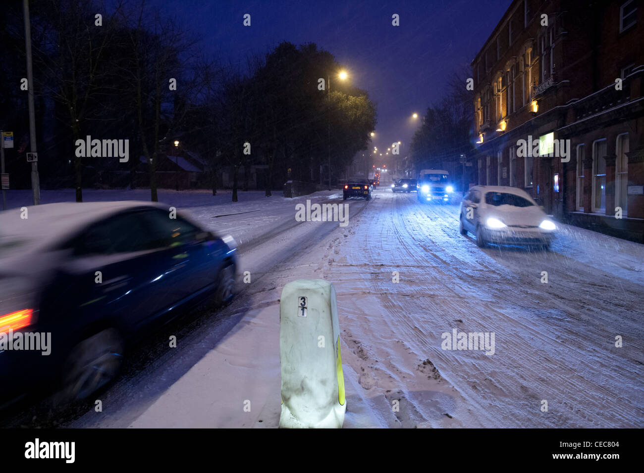 Cars in evening rush hour traffic in snow,snowy,wintry weather Stock Photo