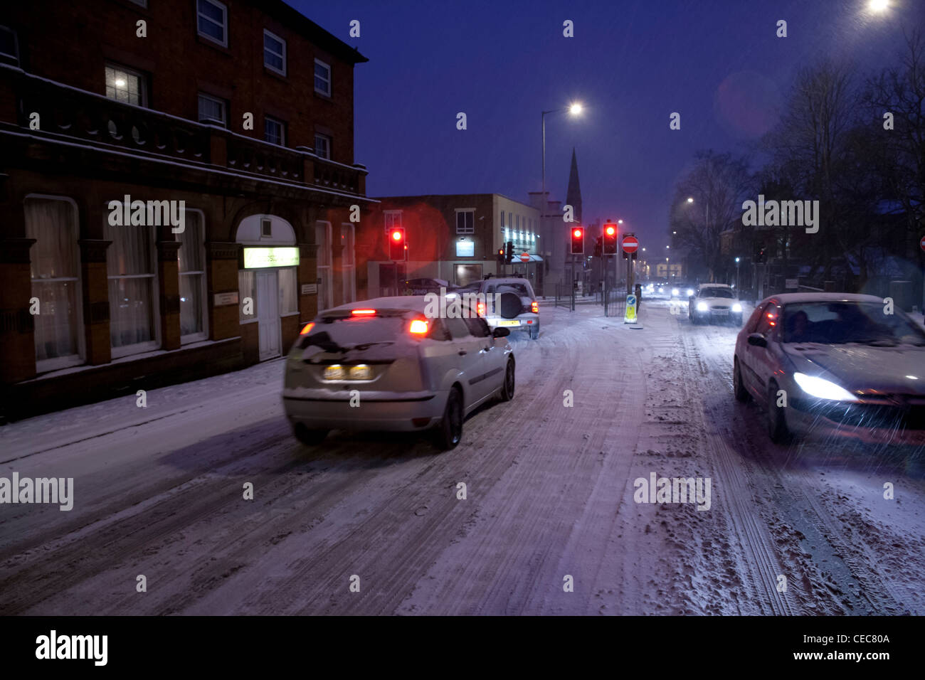 Cars in evening rush hour traffic in snow,snowy,wintry weather Stock Photo