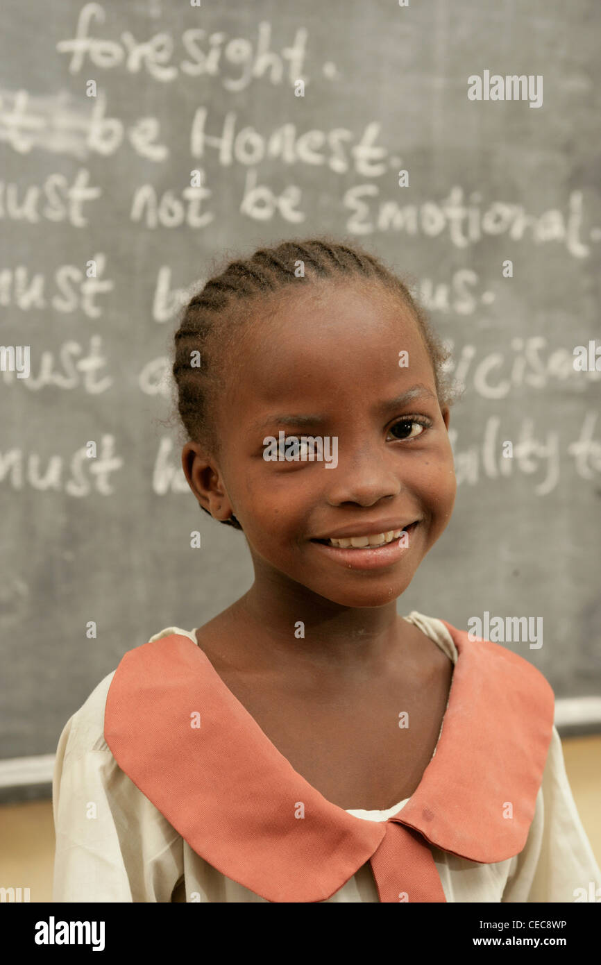 A young girl in front of a blackboard during English class, primary school, Lagos, Nigeria Stock Photo