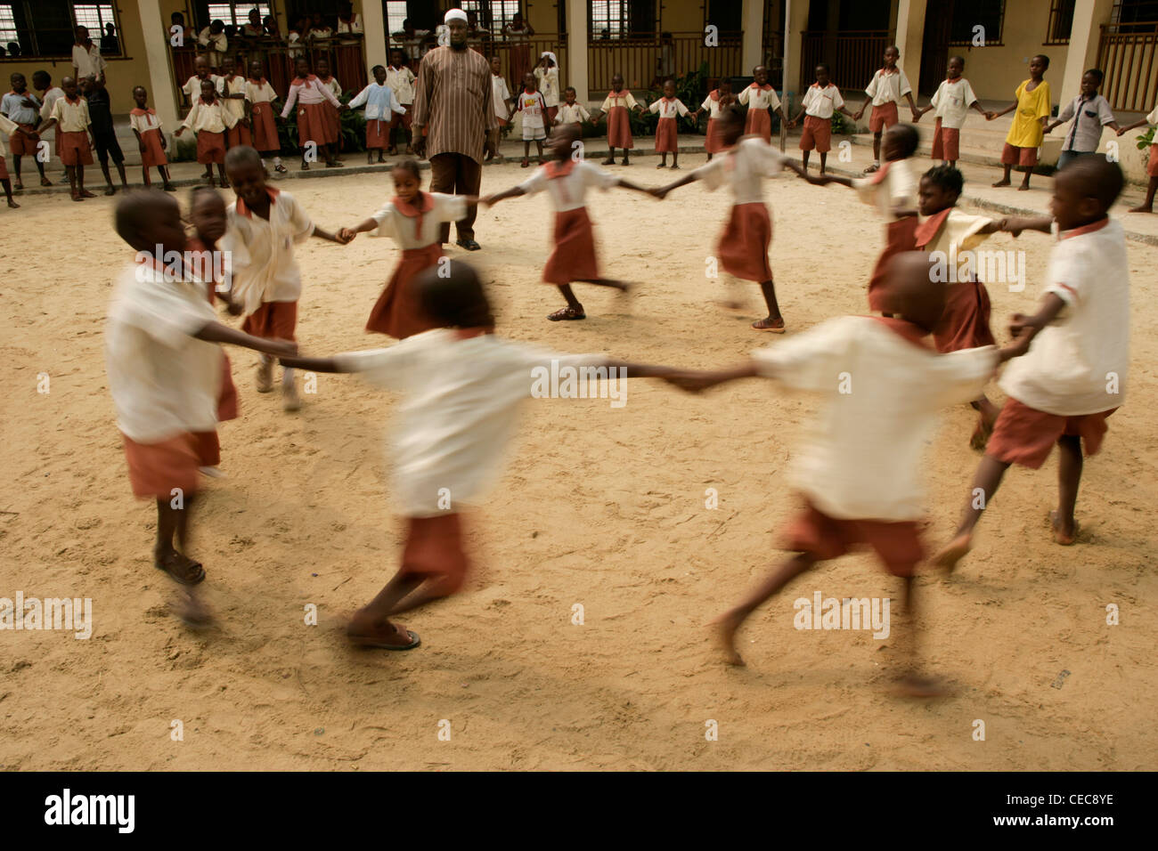 Children dance in a circle during breaktime,  primary school, Lagos, Nigeria Stock Photo