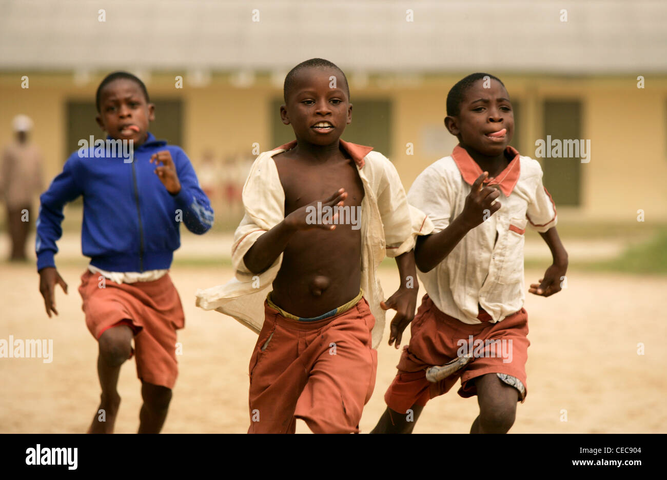 Boys run a race during breaktime at a primary school in Lagos, Nigeria Stock Photo