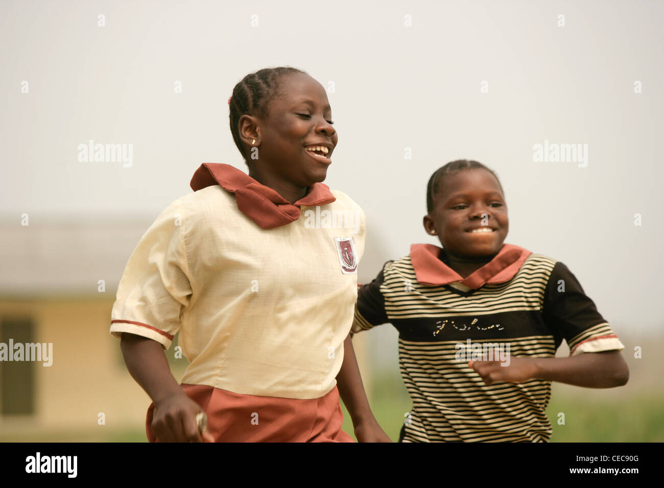 girls run a race during breaktime at a primary school in Lagos, Nigeria Stock Photo
