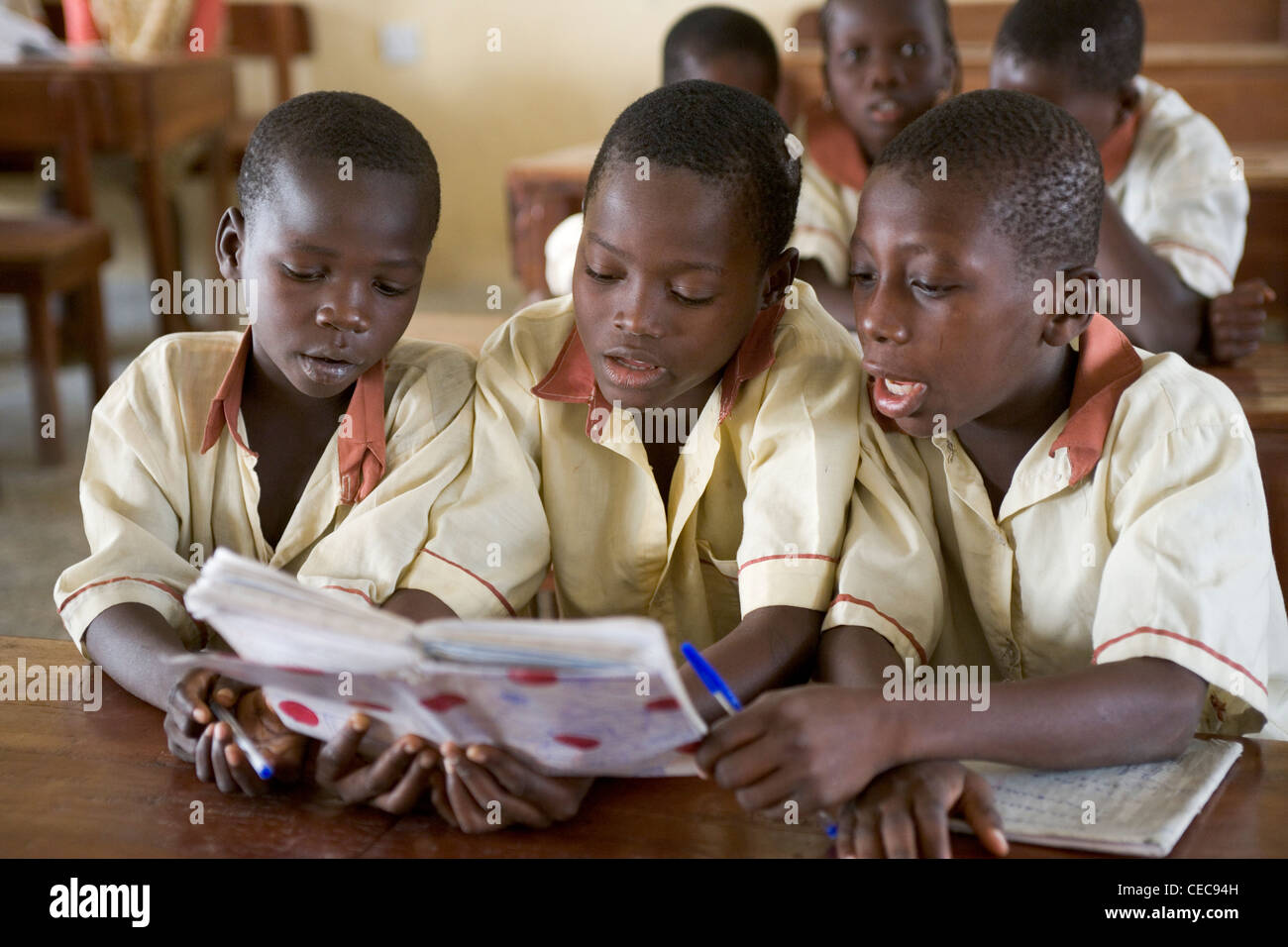Left to right Edatomola Obadia, Ramadan Salami  and Ahmed Amuni during English class at a primary school in Lagos,  Nigeria Stock Photo