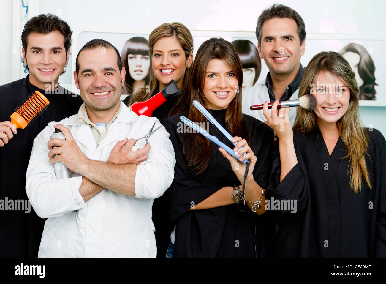 Hispanic clients and stylists in beauty salon Stock Photo