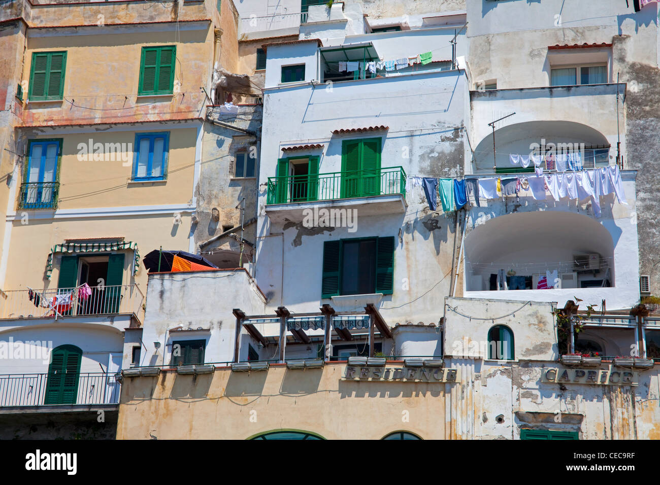 Old house facades with outhanging laundry, village Amalfi at Amalfi coast, Unesco World Heritage site, Campania, Italy, Mediterranean sea, Europe Stock Photo
