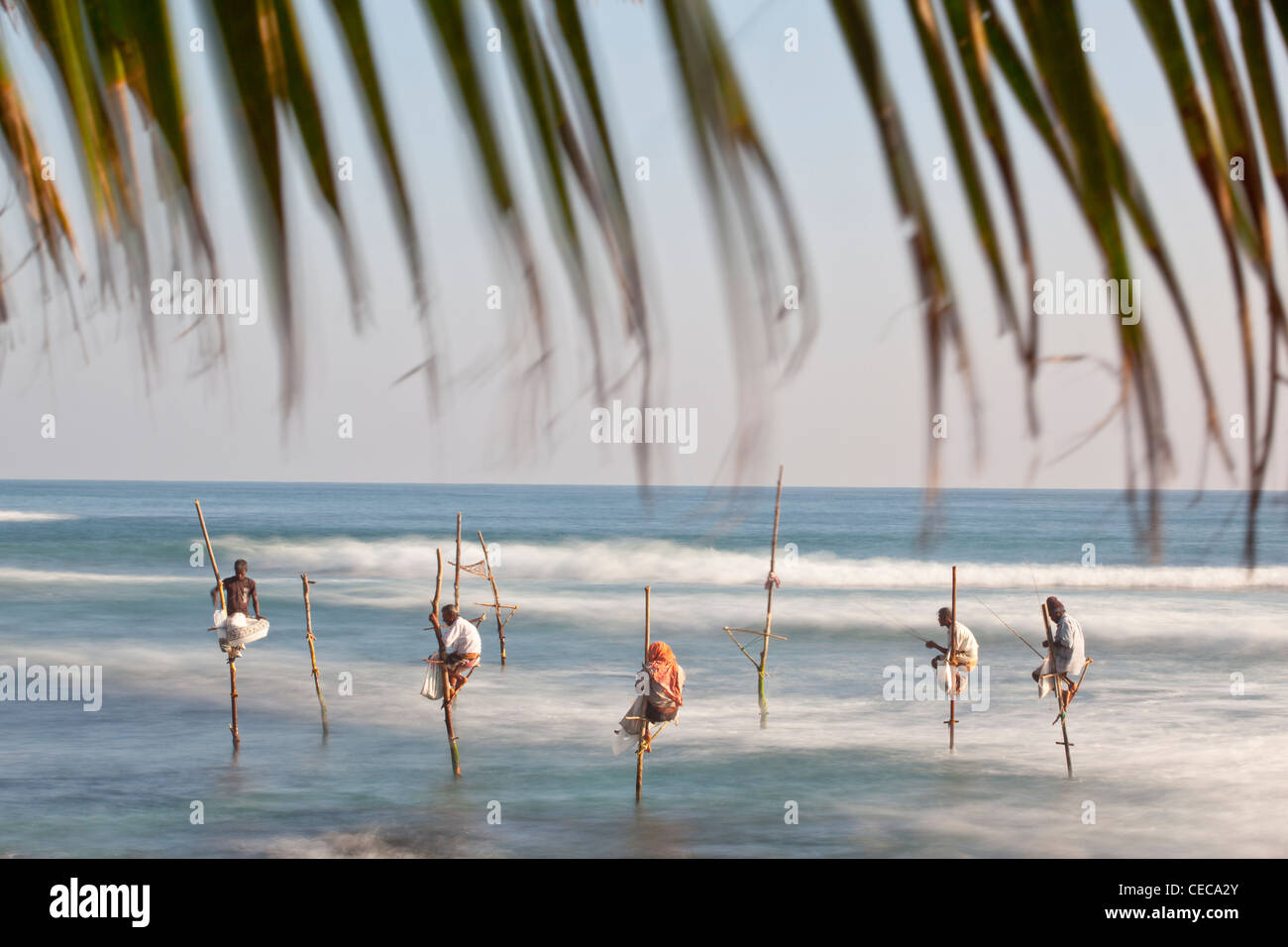 Stilt fishermen Indian Ocean Sri Lanka Asia Stock Photo