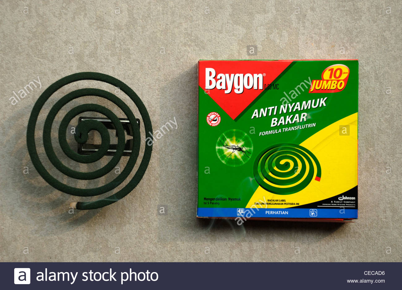 A slow burning coil of mosquito repellent and the Baygon 
