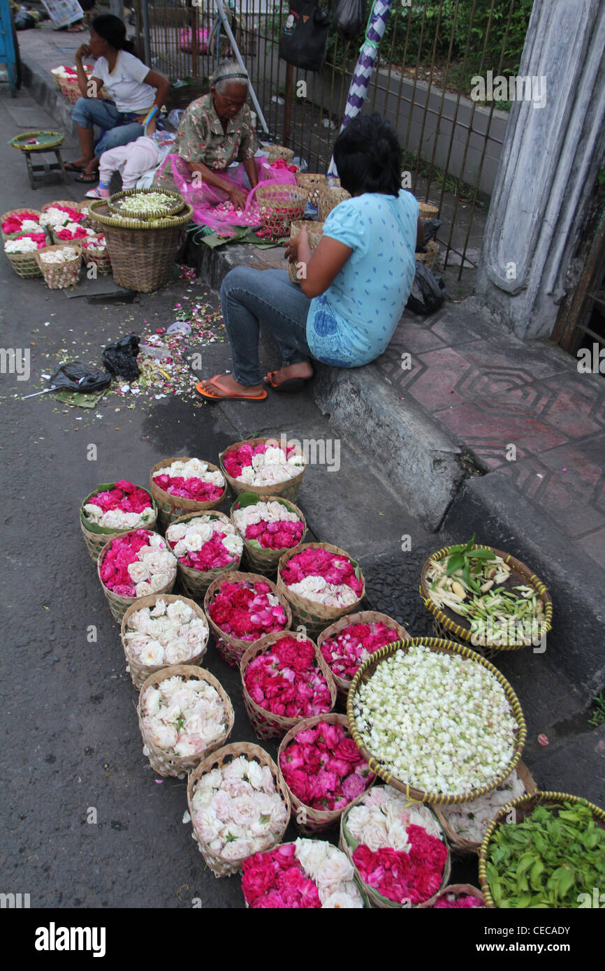 woman selling flowers roadside market village Yogyakarta Indonesia Stock Photo