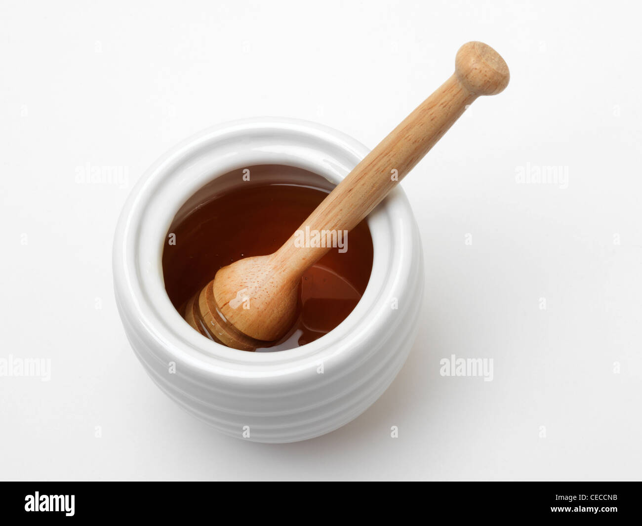 Honey In Honey Pot With Wooden Dipper Stock Photo Alamy