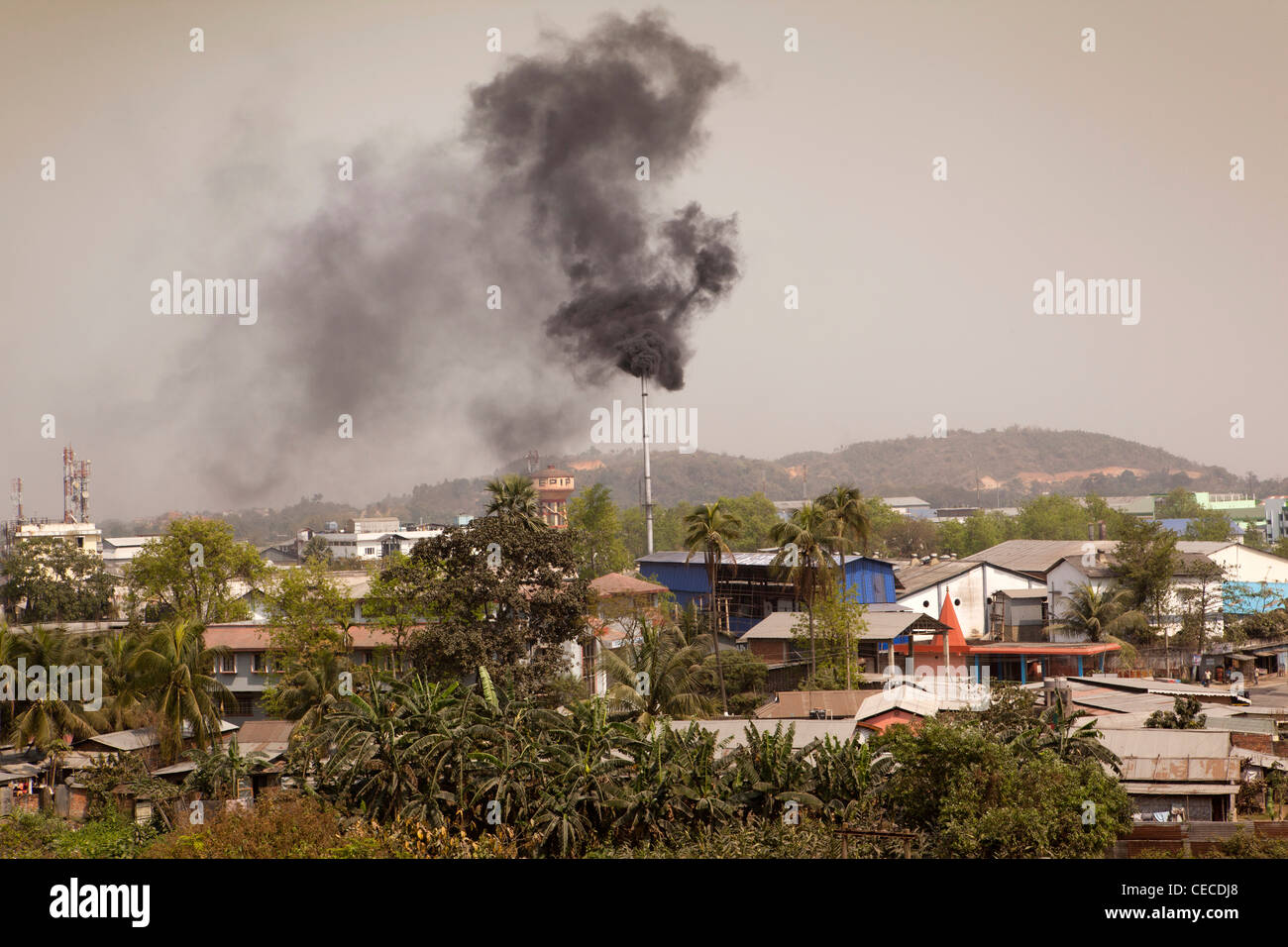 India, Assam, Guwahati, Amingaon, Assam Export Promotion Industrial Park (EPIP) chimney emitting black smoke Stock Photo