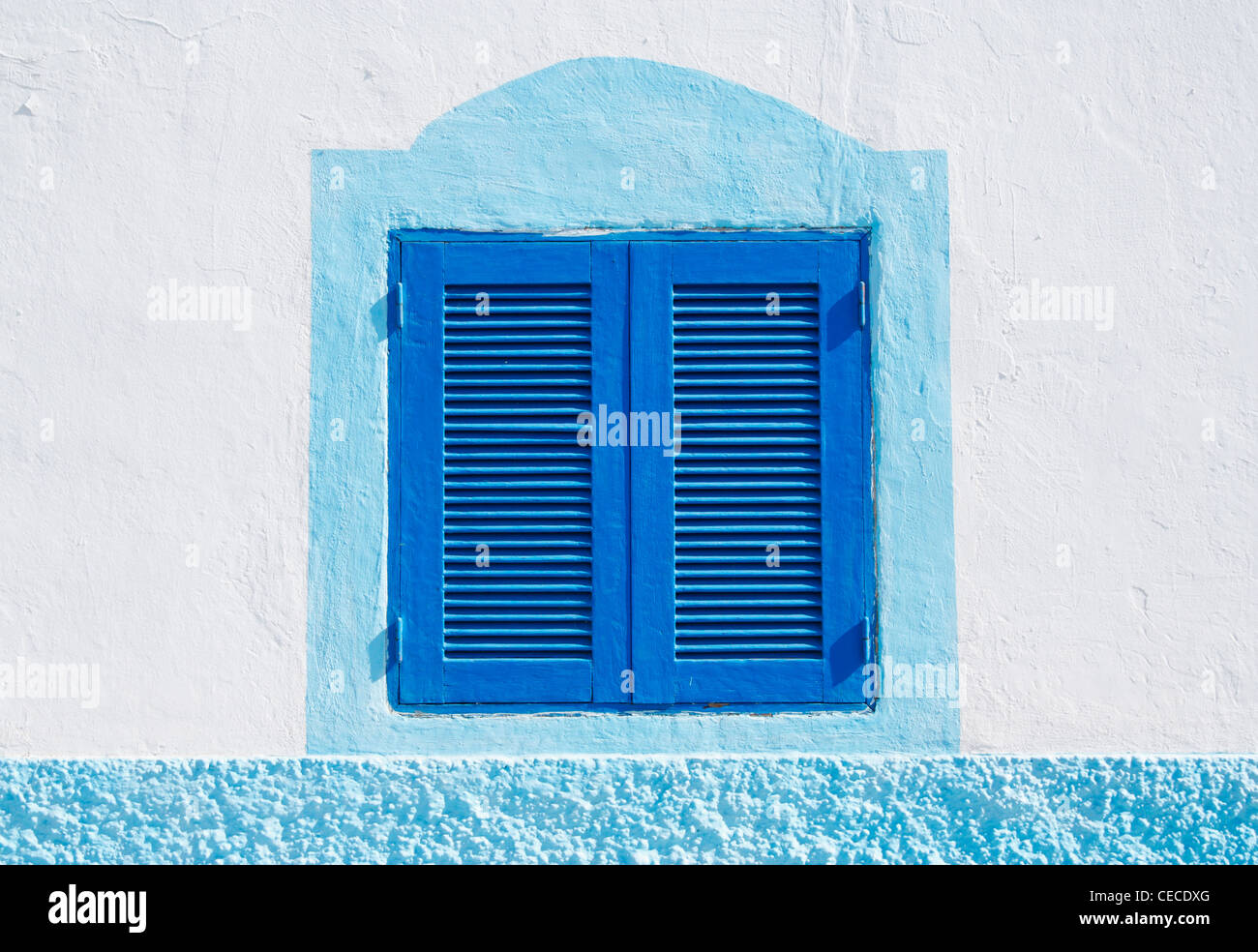 Blue wooden shutters on house in Spain Stock Photo