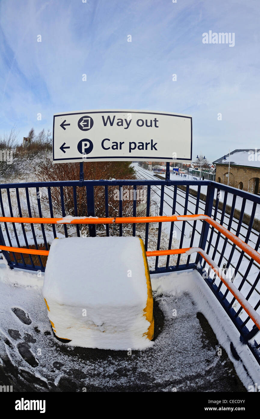 Train station signs pointing to the to the way out or car park. Stock Photo