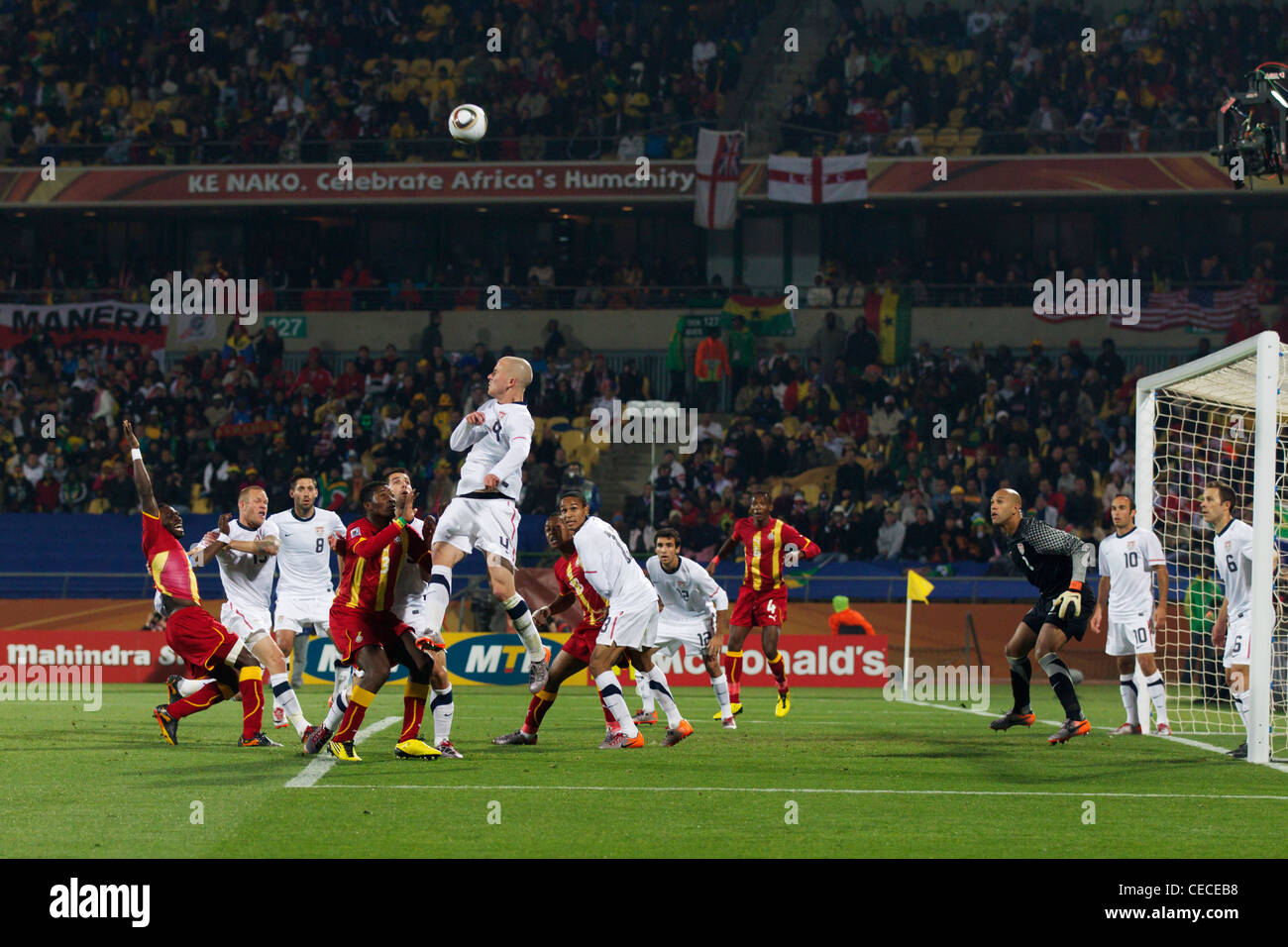 Michael Bradley of the USA jumps for the ball during a 2010 FIFA World Cup round of 16 match against Ghana. Stock Photo