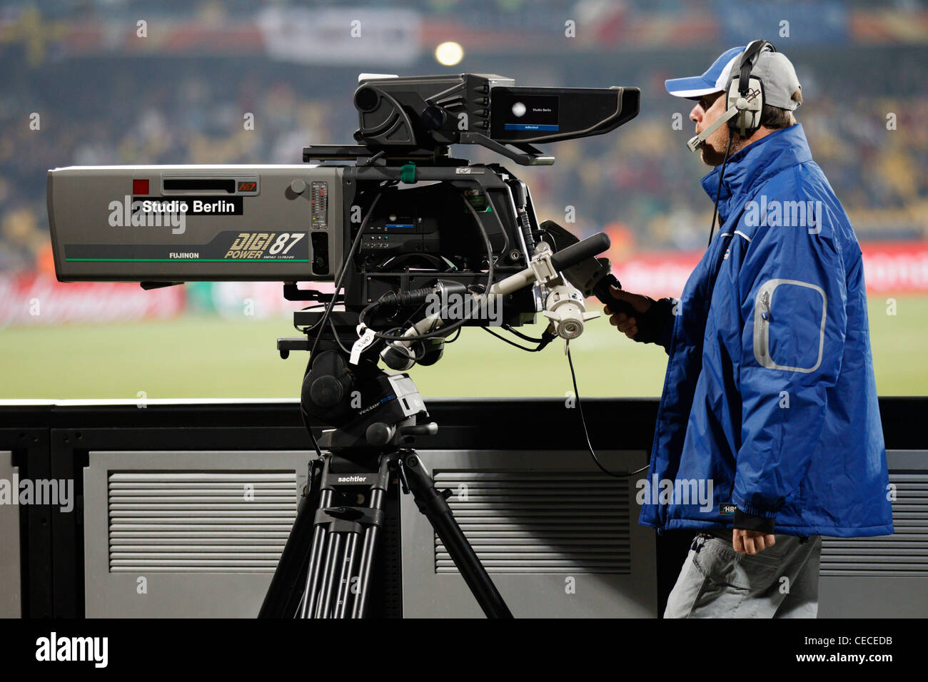 A television camera and operator in position at Royal Bafokeng Stadium in Rustenburg, South Africa for a World Cup soccer match. Stock Photo