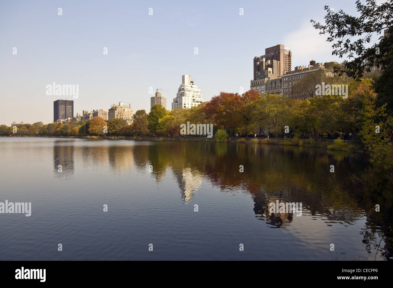 Belvedere Lake in autumn looking towards the architecture on 5th Avenue next to Central Park, New York, USA Stock Photo