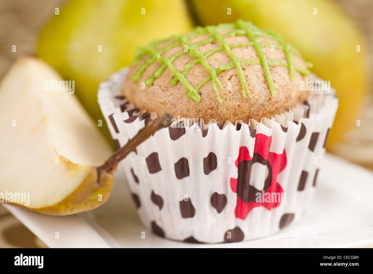 Pear muffin on white plate, selective focus Stock Photo
