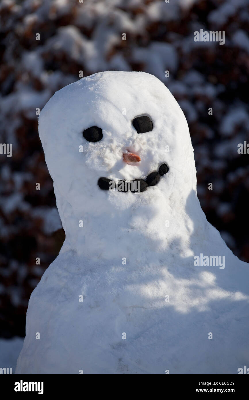 Snowman with smiley face Stock Photo
