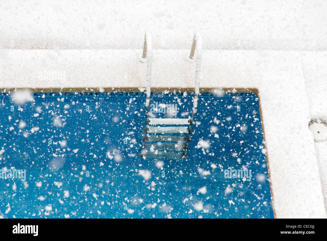 Snowing on Swimming pool outdoor Stock Photo