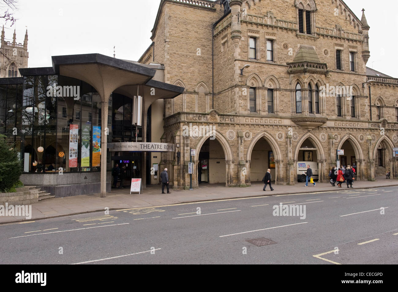 People walk past exterior of The Theatre Royal in York (historic building with Gothic frontage & Modernist extension) - North Yorkshire, England, UK. Stock Photo