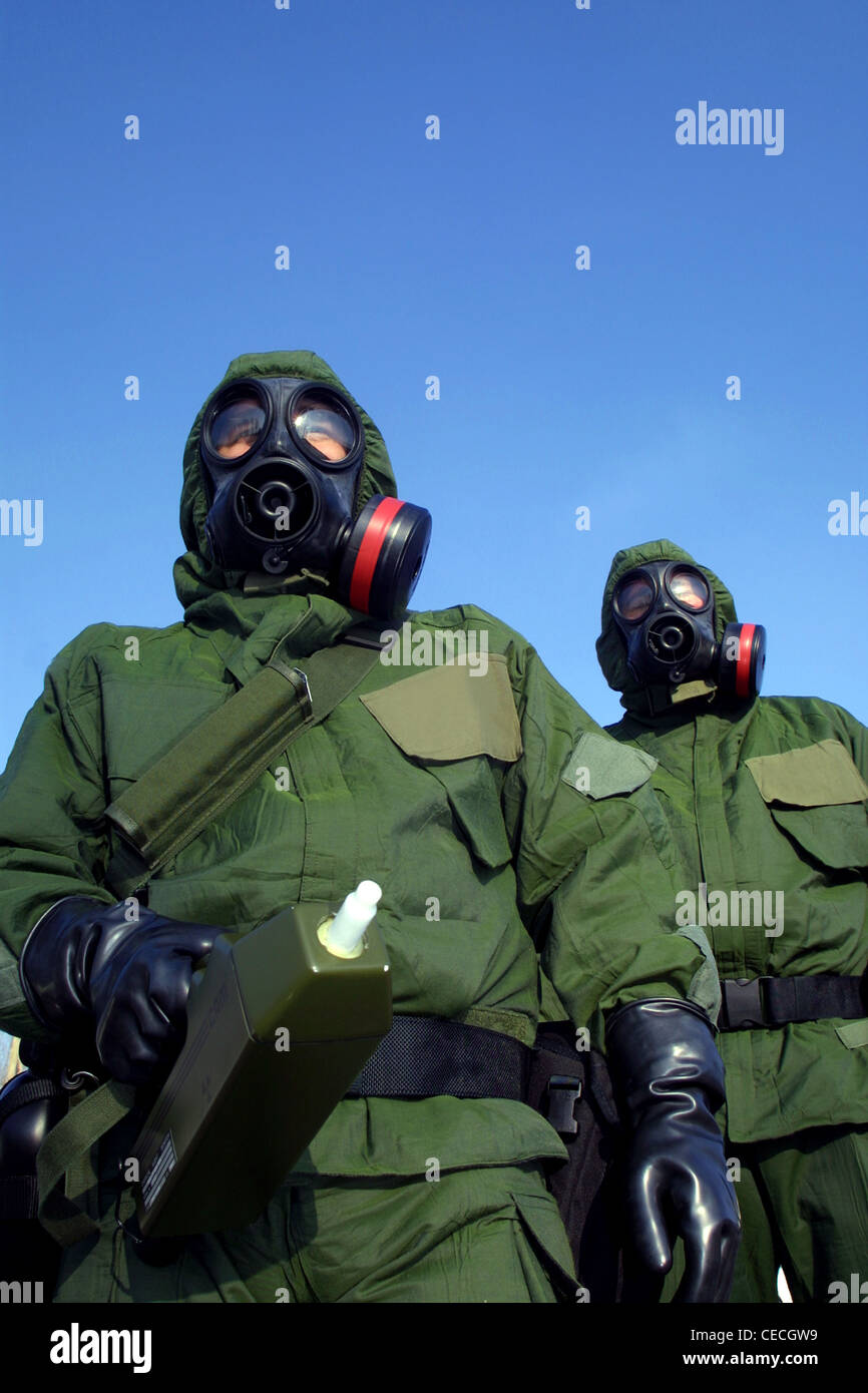 Policemen in England wearing chemical warfare suits Stock Photo