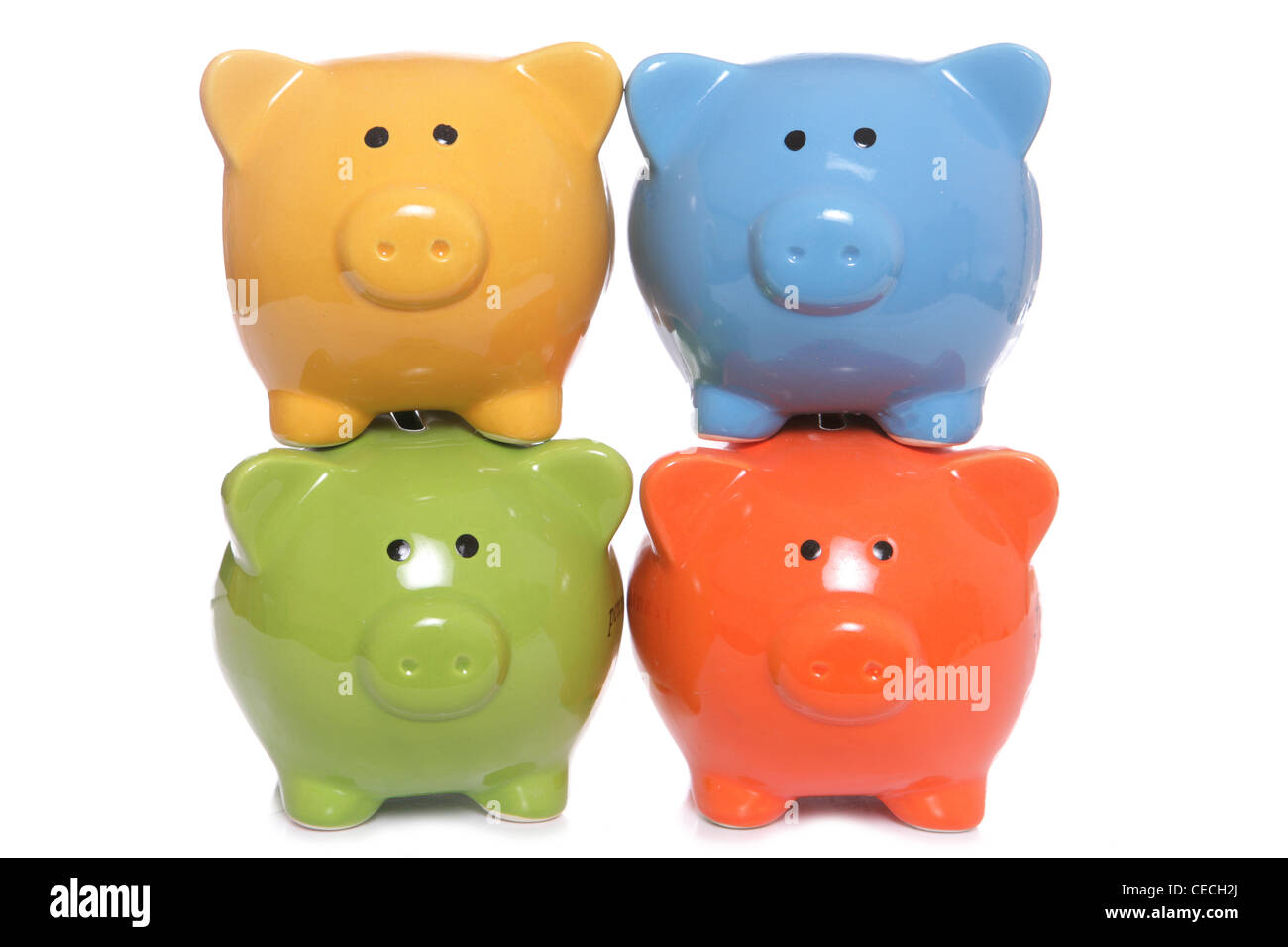 Piggy banks stacked on a white background Stock Photo - Alamy