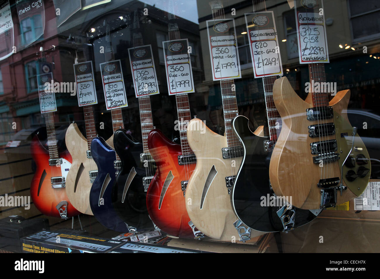 Selection of guitars pictured in 'The Guitar, Amp & Keyboard Centre' shop window in Brighton, East Sussex, UK. Stock Photo