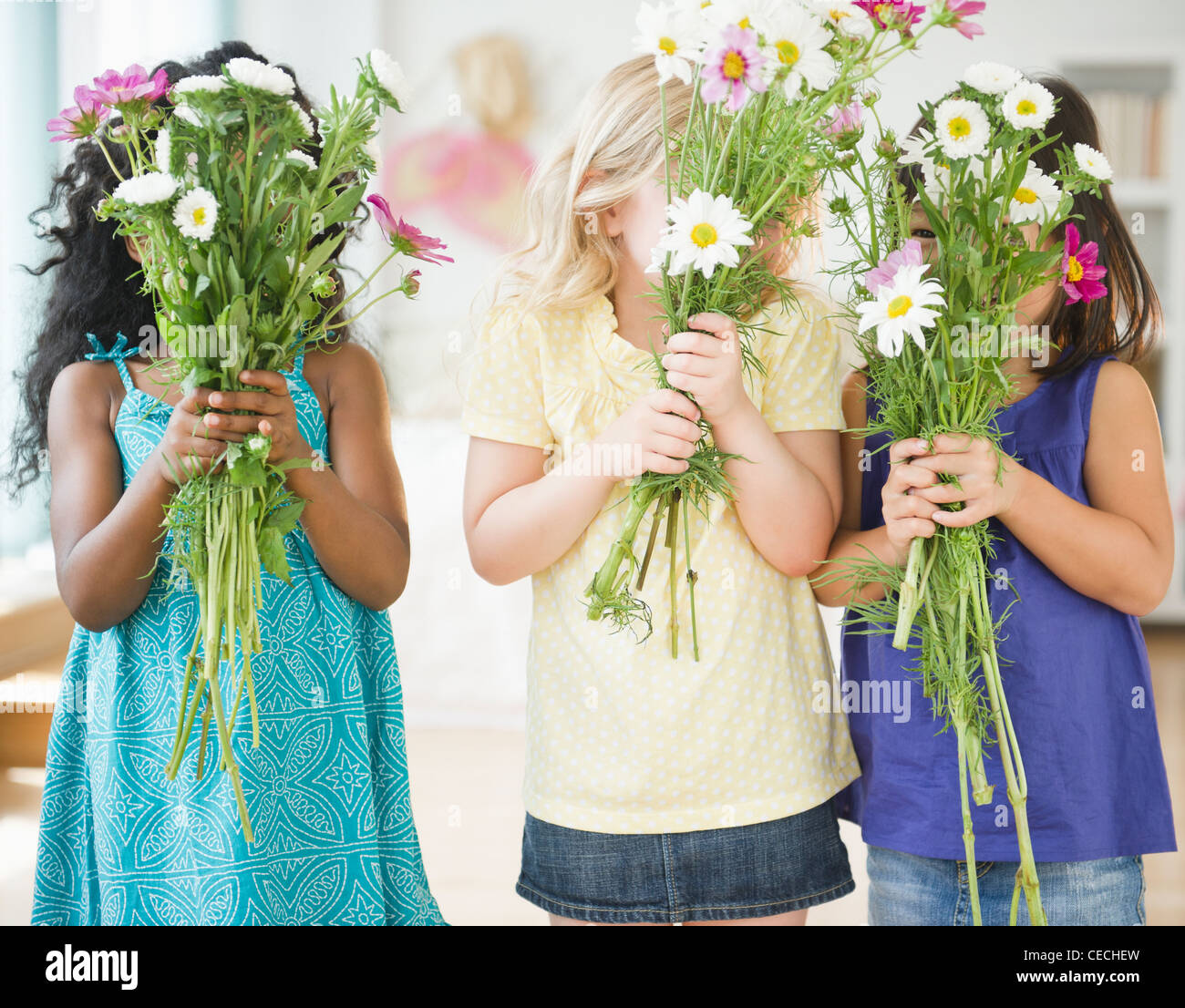 Girls holding bouquets of flowers Stock Photo Alamy
