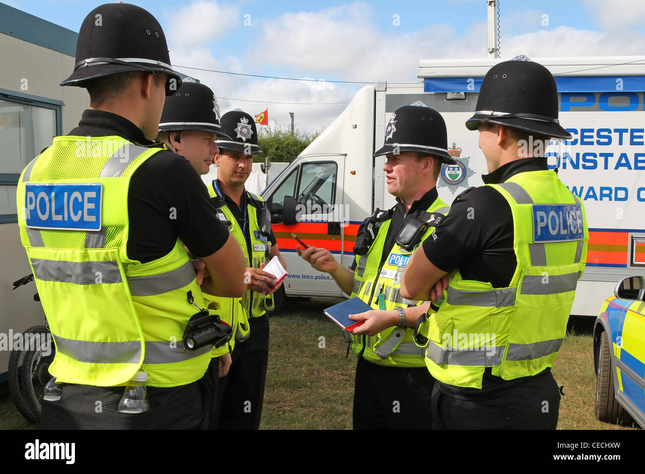 Policemen discuss security at the British Formula one Grand Prix Stock Photo