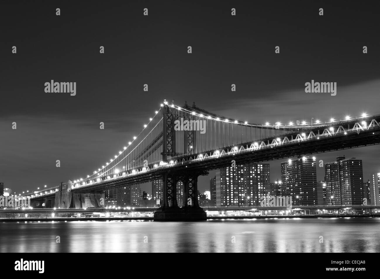Manhattan Skyline and Manhattan Bridge At Night, New York City Stock Photo