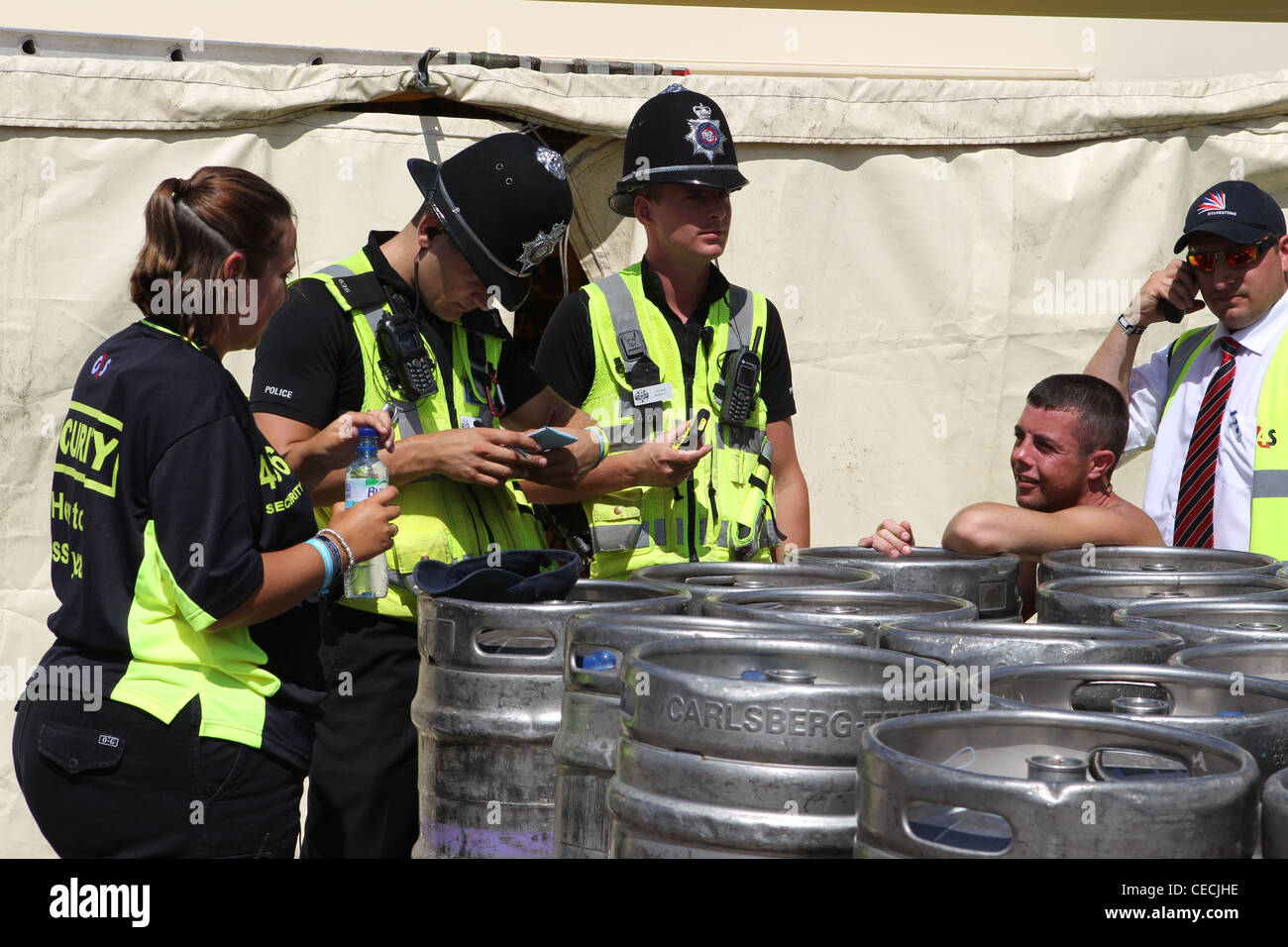 Police questioning and arresting man at the British Formula One Grand Prix Stock Photo