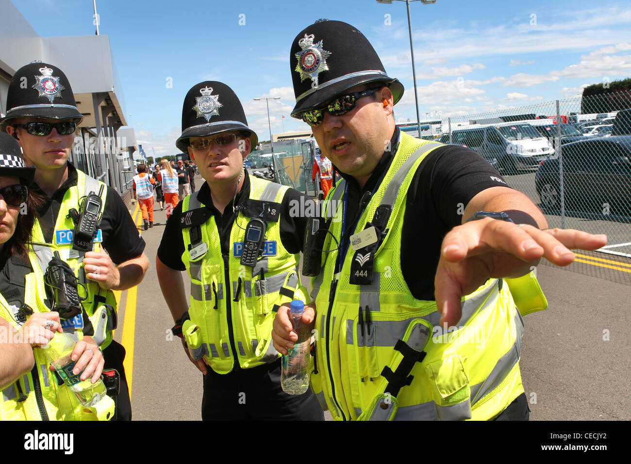 British Police discuss security at the British Formula One Grand Prix, Silverstone Stock Photo