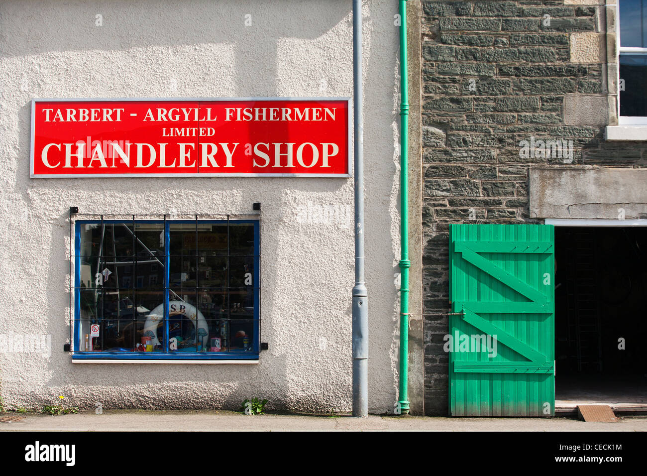 A chandlery store in the middle of Tarbert harbour on Kintyre on Scotland's west coast. Stock Photo