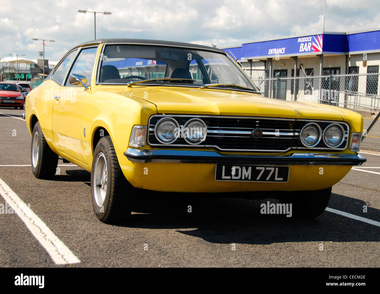 Bright Yellow Ford Cortina Mk3 2000cc GT, Parked in the paddock at  Silverstone Stock Photo - Alamy