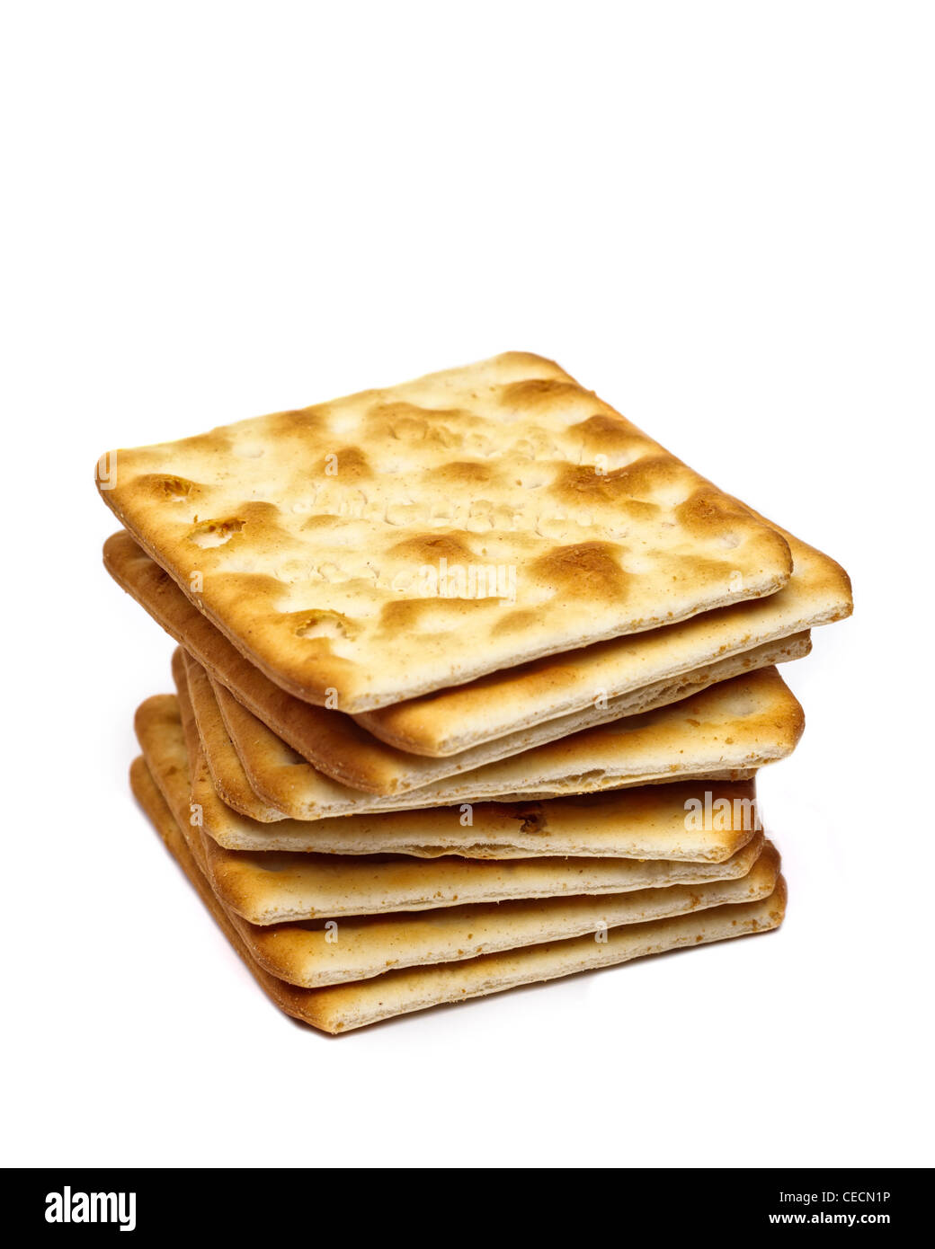Pile of Jacobs cream crackers cheese biscuits on white background Stock Photo