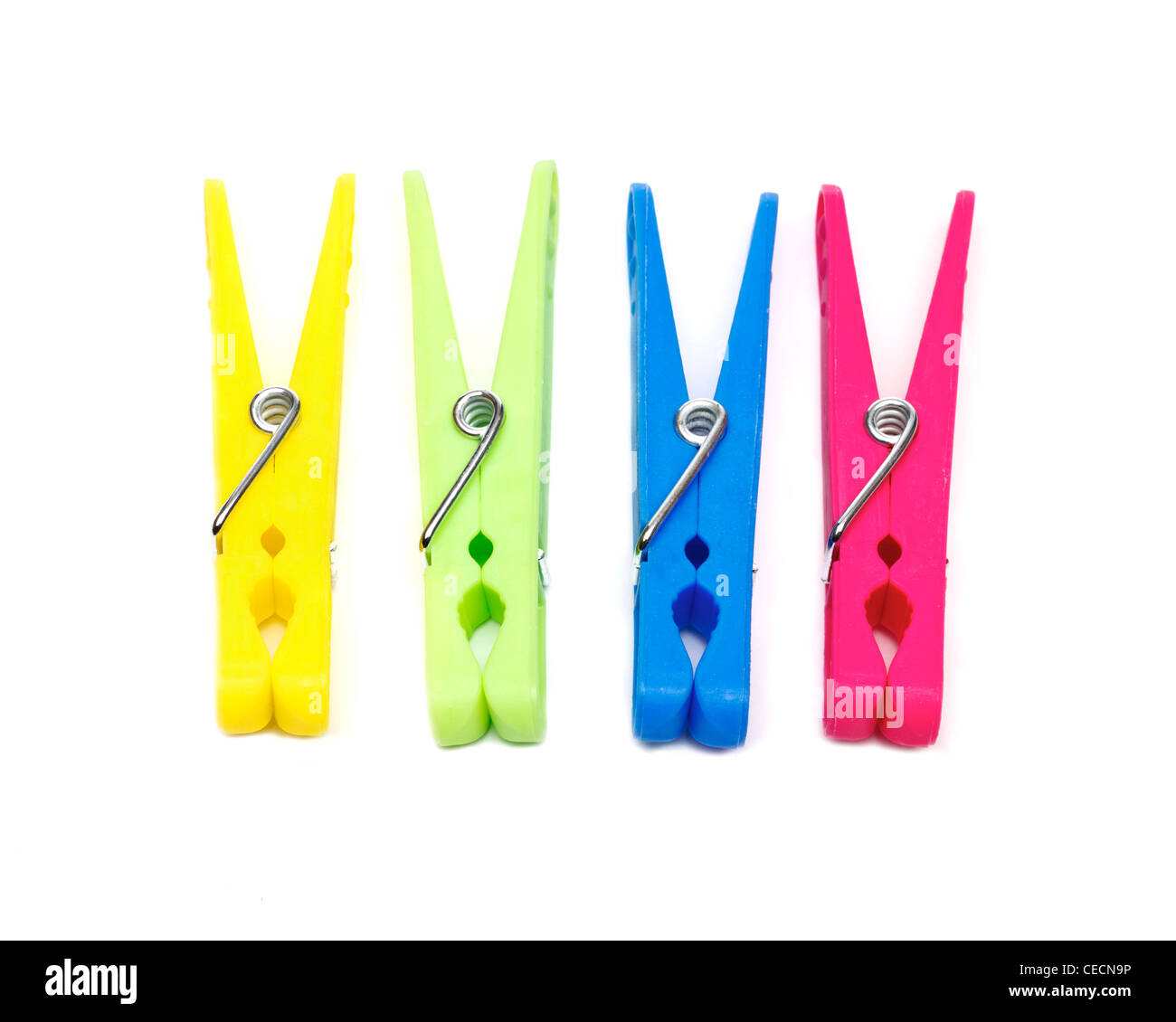 Colourful clothes pegs on a white background Stock Photo