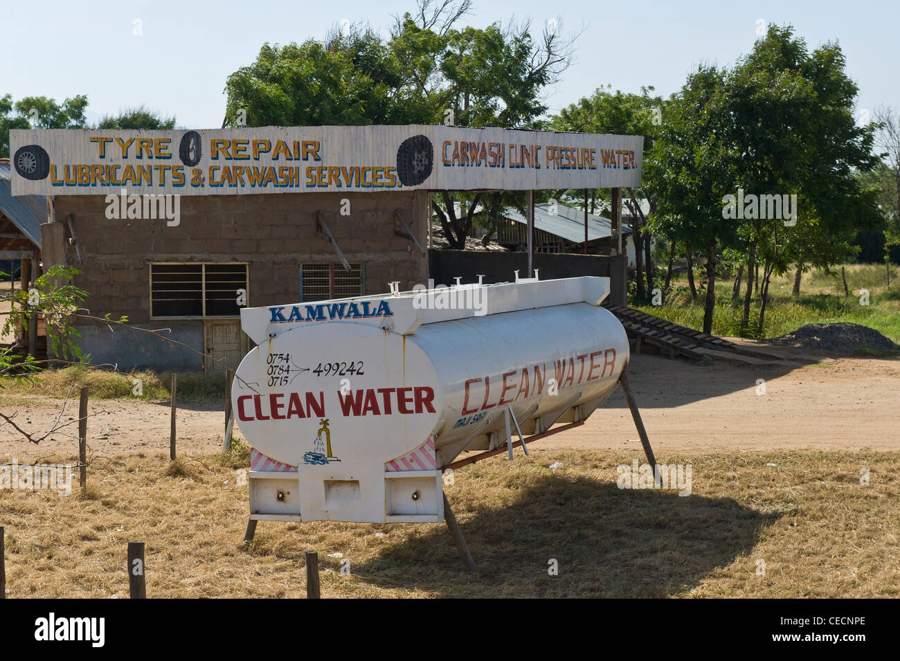Old fuel tanker used to advertise the delivery of clean drinking water in Korogwe Tanzania Stock Photo