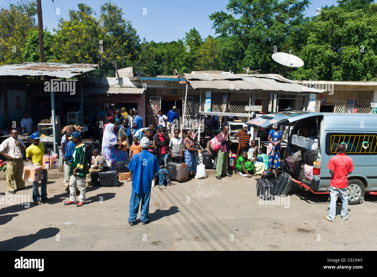 People at a bus stop in Mombo in Tanga Region Tanzania Stock Photo