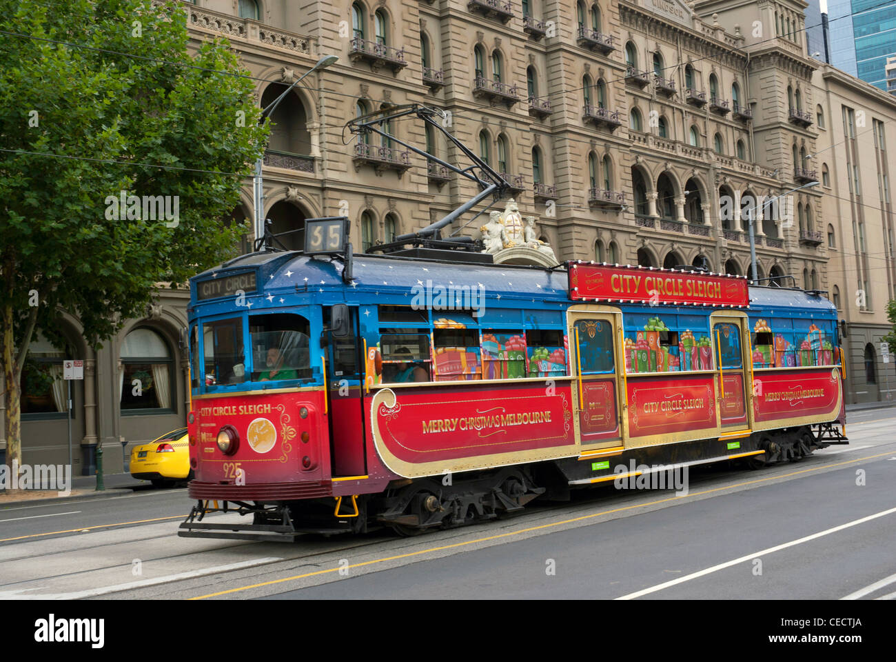The number 35 City Circle tram in its Christmas livery, in Melbourne city centre Stock Photo