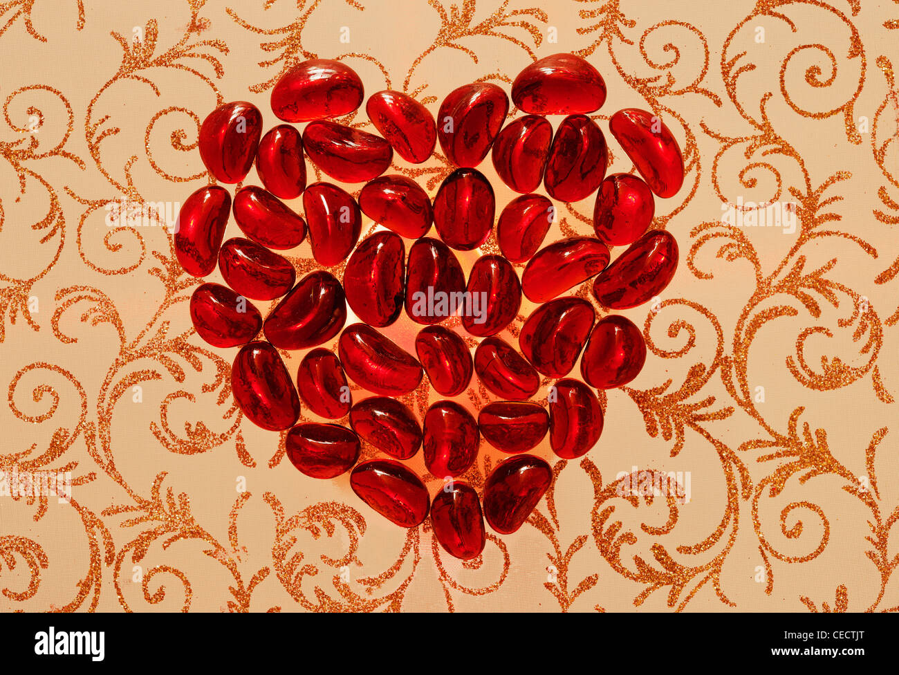 Red Heart on a gold figured background Stock Photo