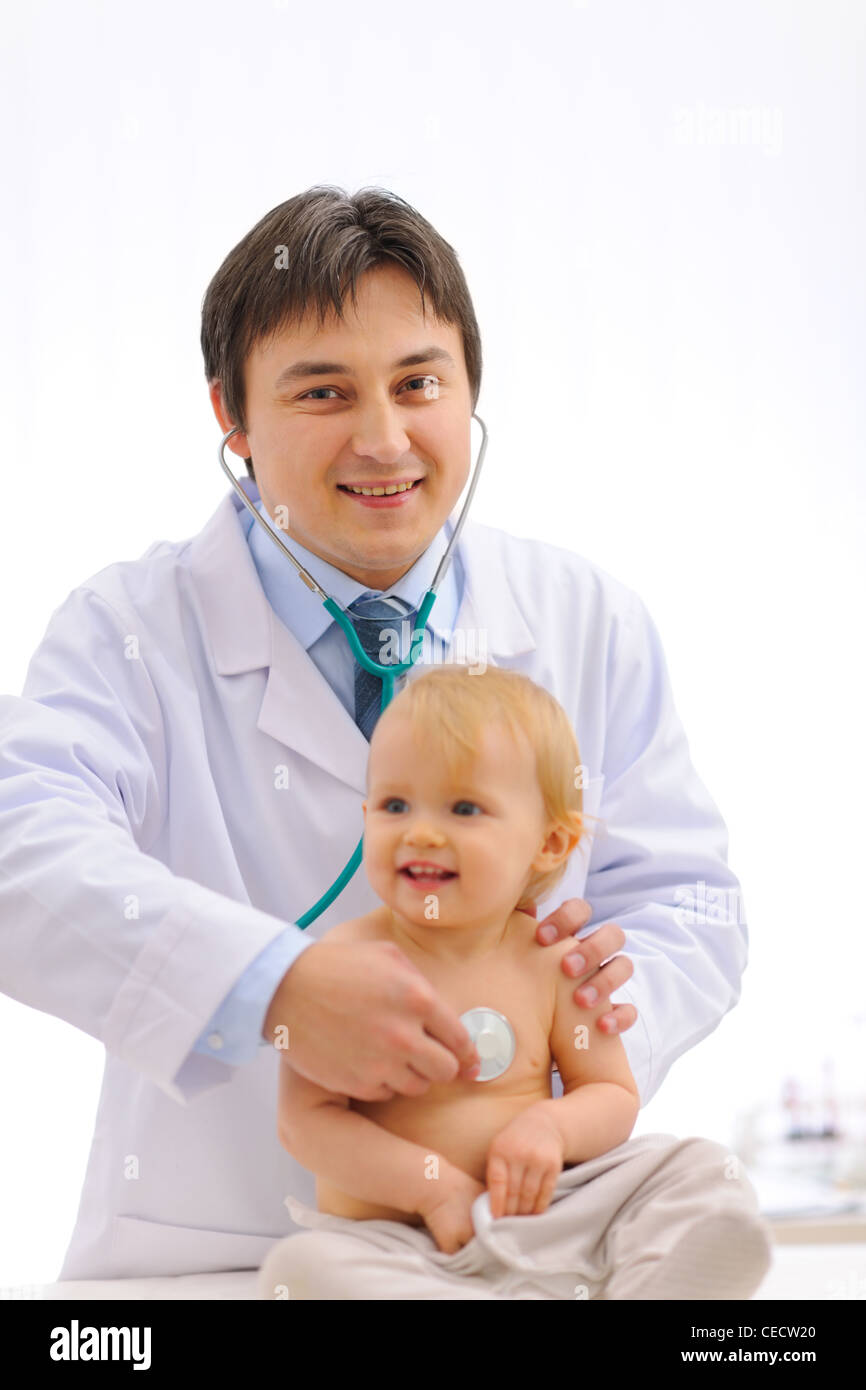 Smiling pediatric doctor checking baby using stethoscope Stock Photo Alamy