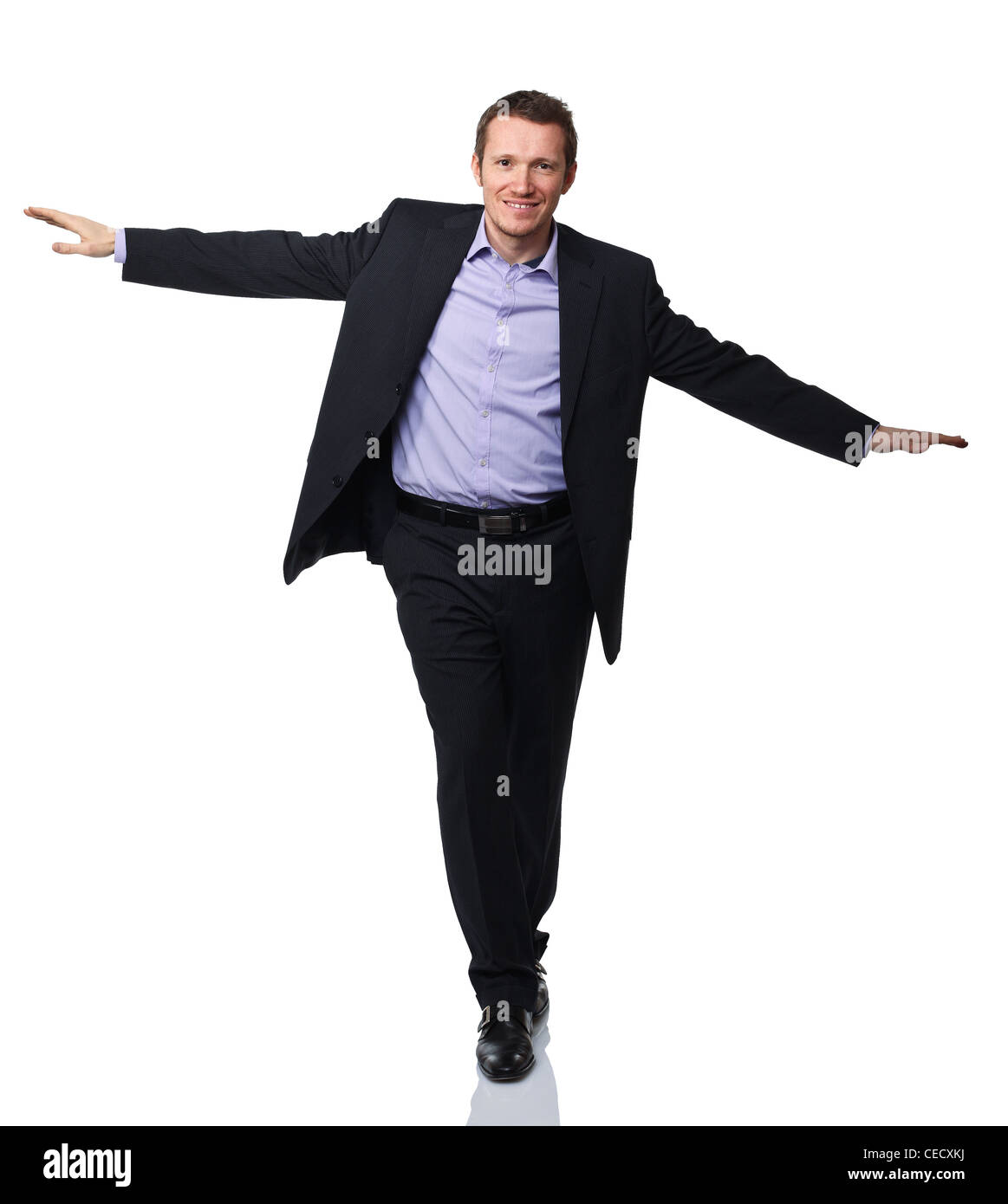 businessman act like acrobat on white background Stock Photo
