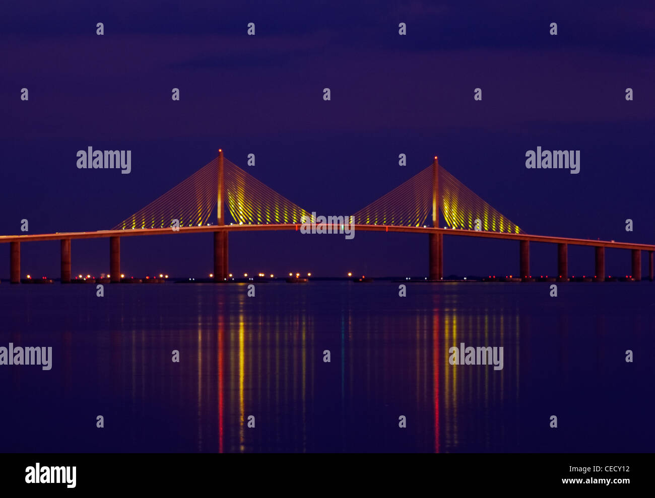 The Bob Graham Sunshine Skyway is a bridge separating Tampa Bay from the Gulf of Mexico in the evening on a calm night.. Stock Photo