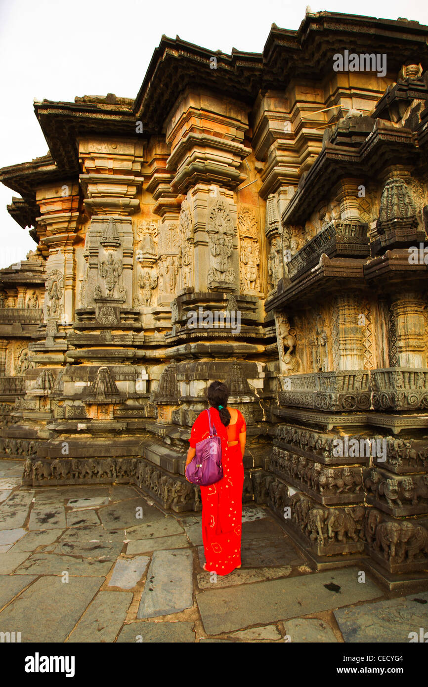 Indian woman observing the detailed workmanship in the Channakeshava temple in Belur, Karnataka, India Stock Photo