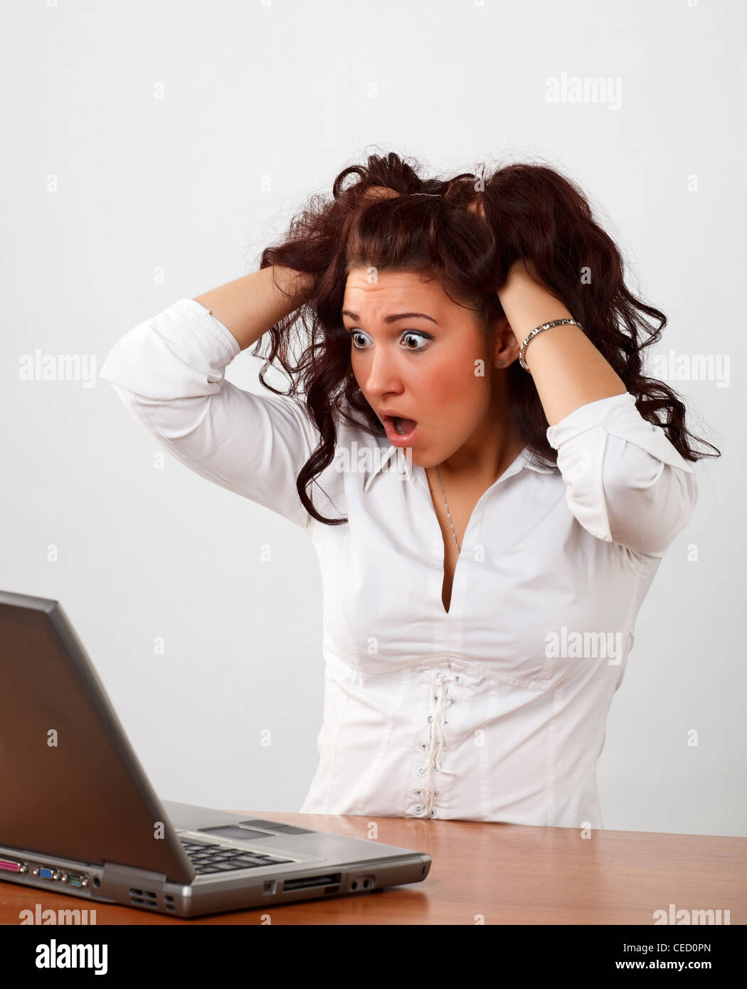 Young woman surfing the Internet on a laptop. Stock Photo